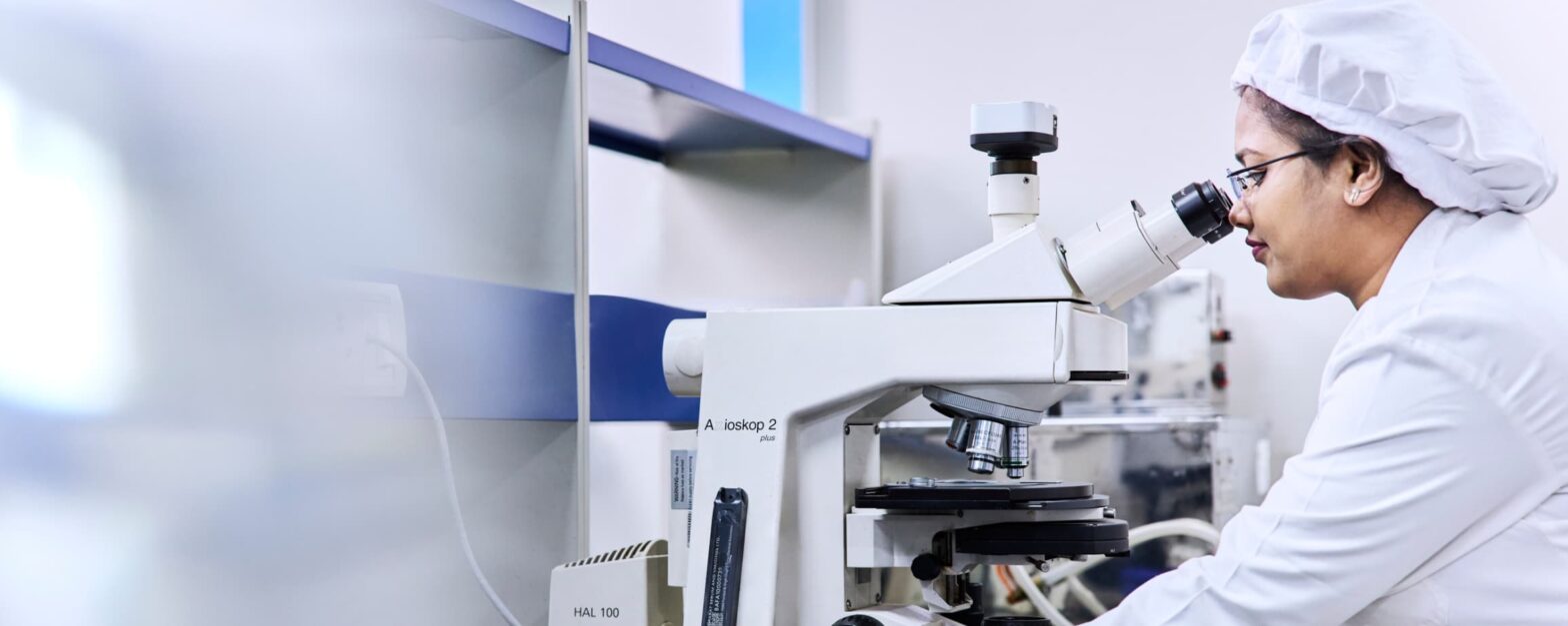 Photo of an individual working in a healthcare lab.