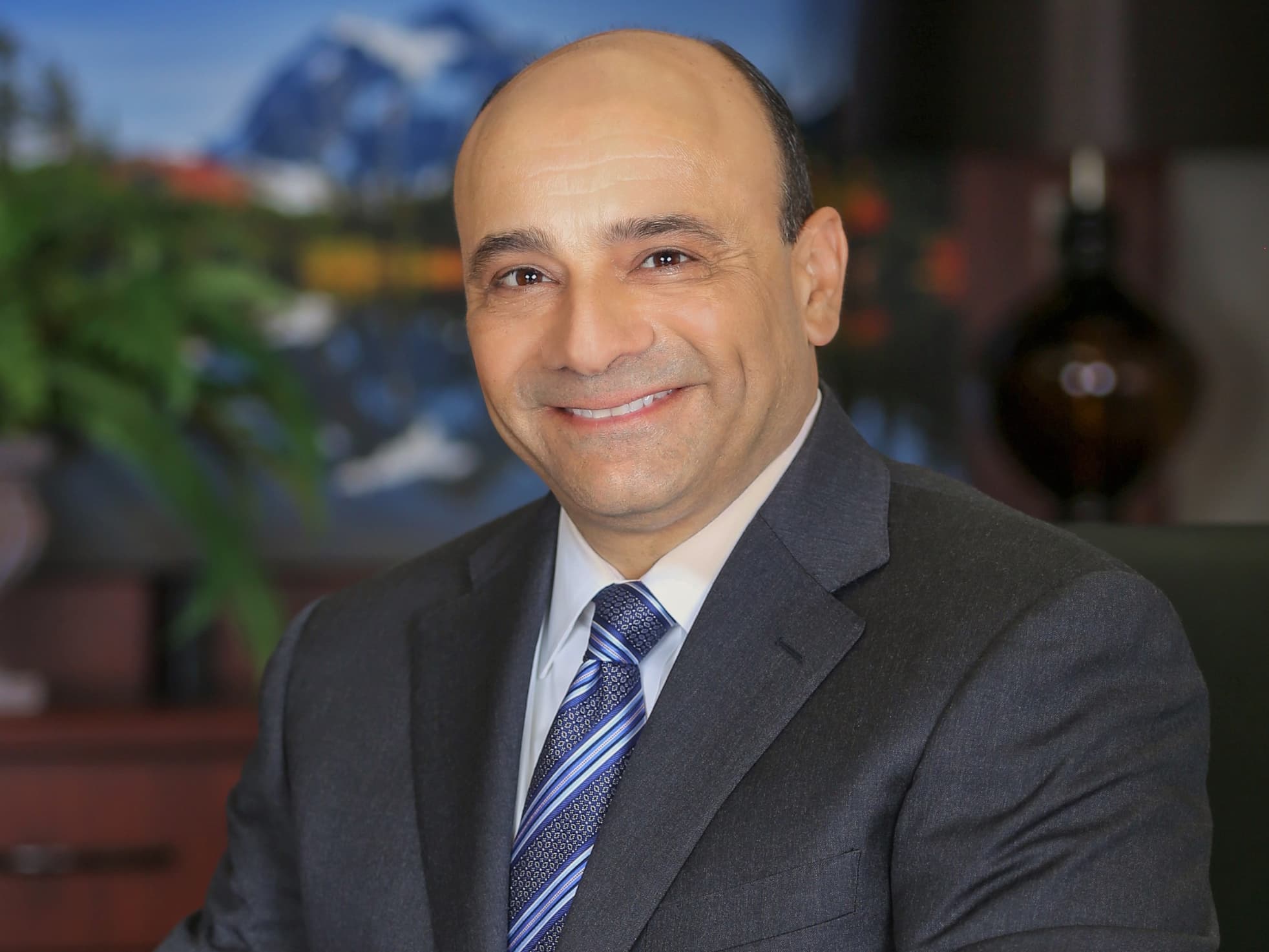 Headshot of John Figueroa, CEO, Genoa Healthcare